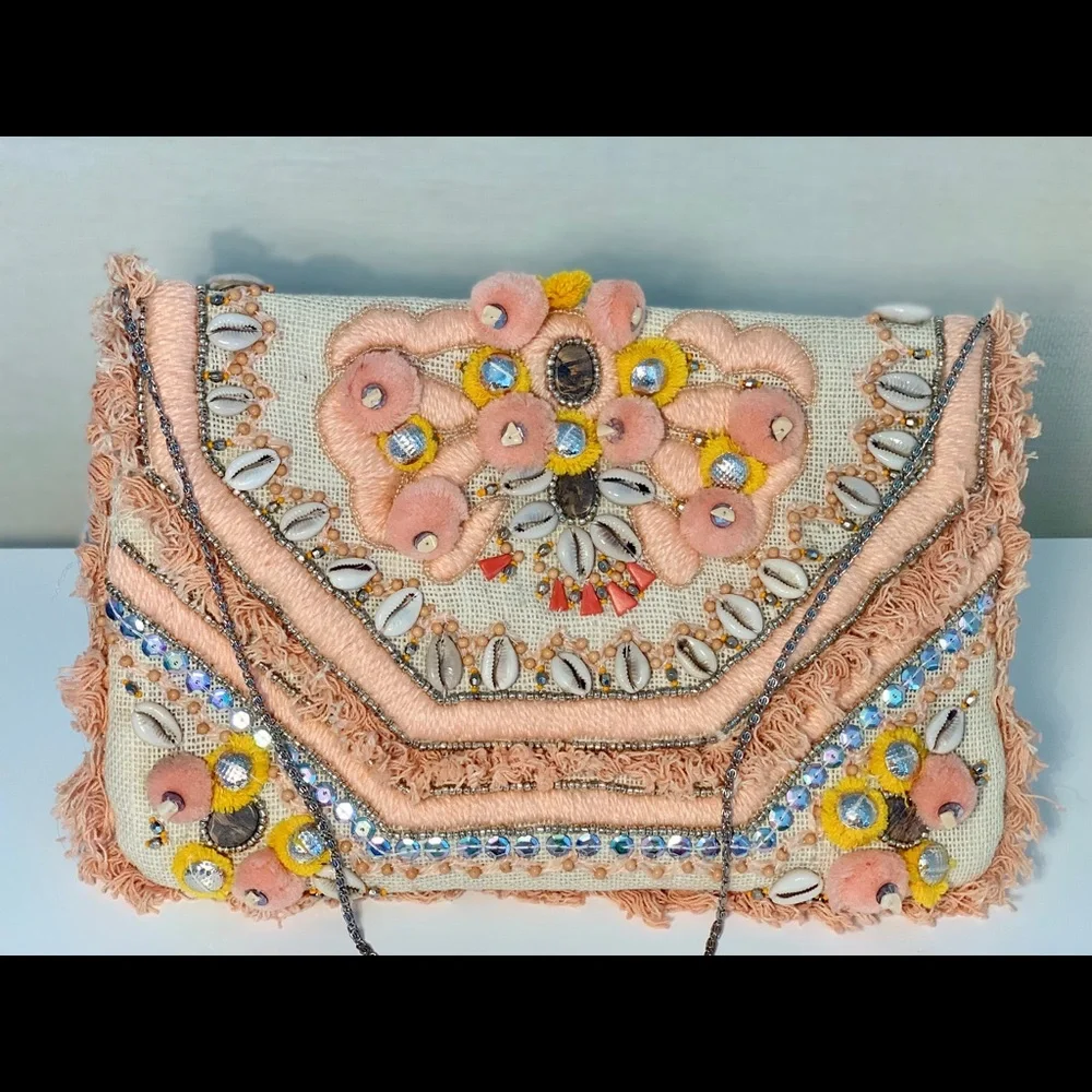 Canvas clutch with coral‎ and yellow pom-poms
